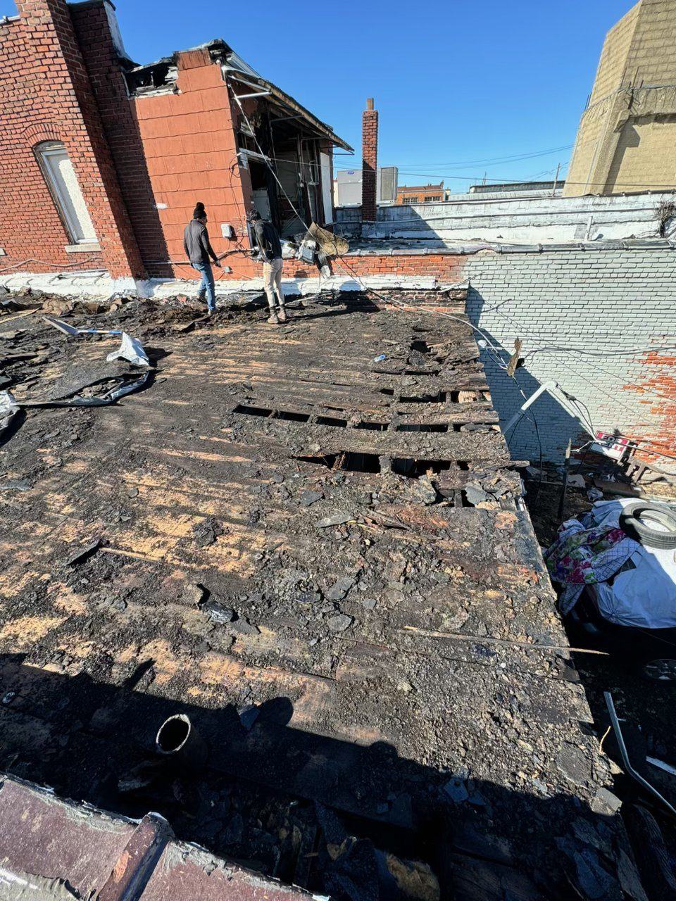 Rotted flat roof deck before replacement